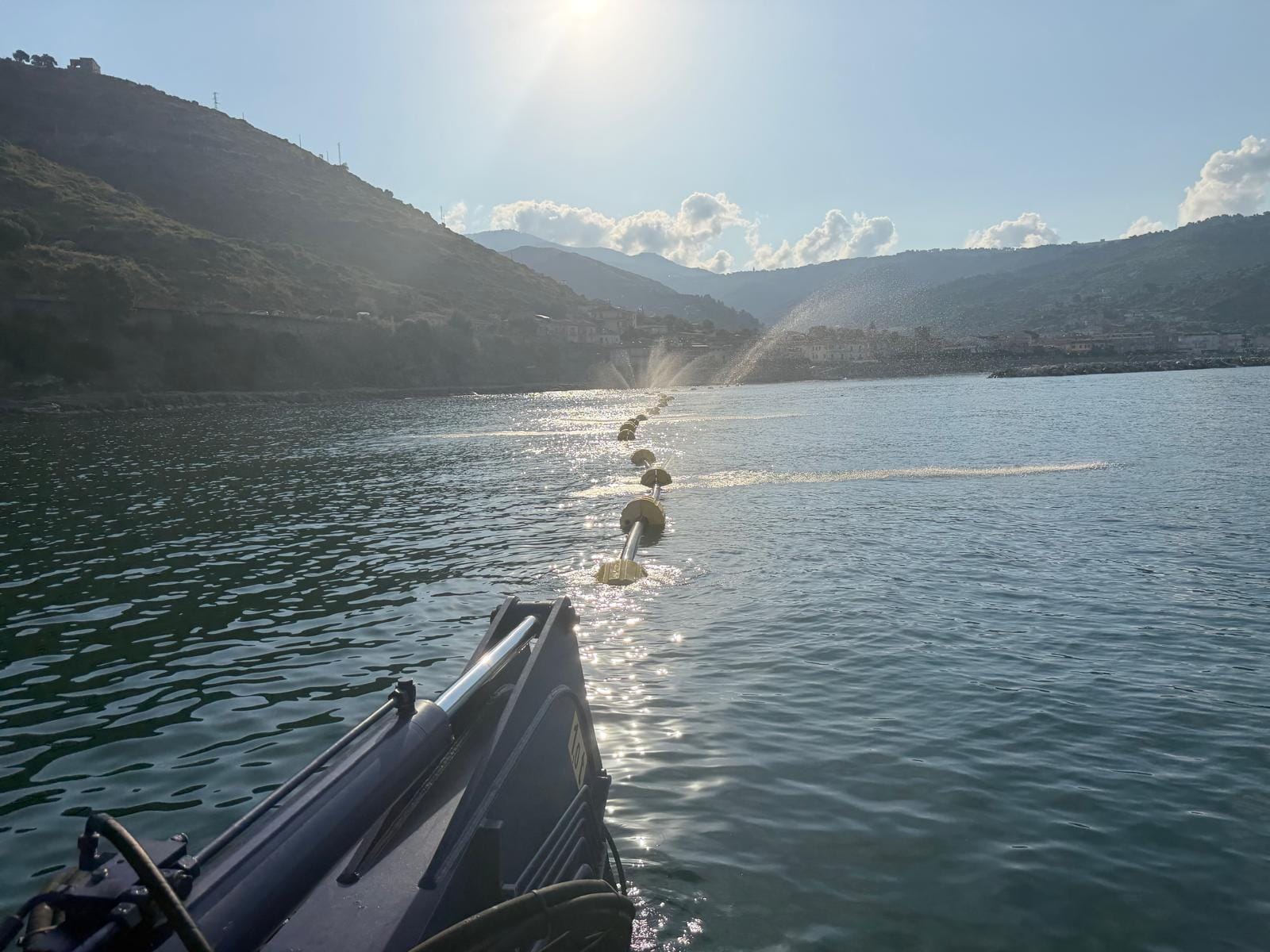 Dredging pipeline with floats along the Montecorice shoreline